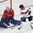 PARIS, FRANCE - MAY 7: Norway's Henrik Haukeland #33 makes a save while Switzerland's Vincent Praplan #8 looks on during preliminary round action at the 2017 IIHF Ice Hockey World Championship. (Photo by Matt Zambonin/HHOF-IIHF Images)